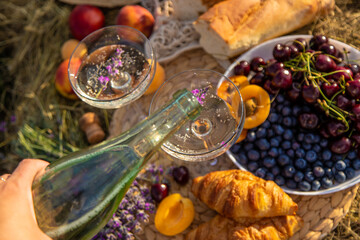Picnic with wine in a lavender field. Selective focus.