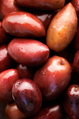 Kalamata olives with a stone, macro. Olives background photography