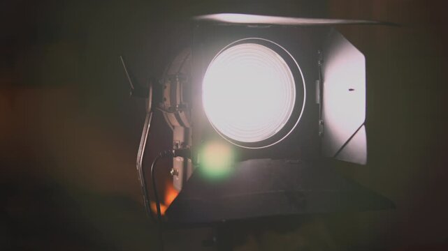 Professional studio light with barn doors turning on and off. Media