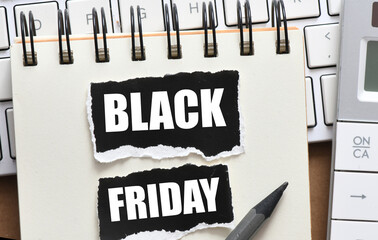 Black Friday words written on a piece of paper. Time for promotions and sales in stores.