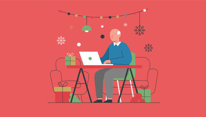 Elderly man working remotely on a laptop during the festive Christmas and New Year season