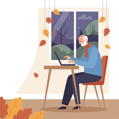 Elderly man working on laptop at home in autumn Cozy seasonal remote work concept