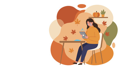 Crying woman looks at a tablet in an autumn setting representing seasonal affective disorder or loneliness