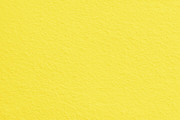 Fototapeta premium Yellow concrete wall texture background. Uneven render stucco painted concrete wall texture background. Rough and grunge wall.