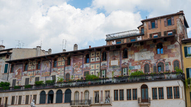 The historic Case Mazzanti in Verona Italy featuring a multi-story facade covered in faded 16th-century frescoes