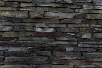 stacked stone wall texture background concept of building construction, architecture, landscaping