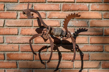 Iron Horse Figure on Red Brick Wall Background