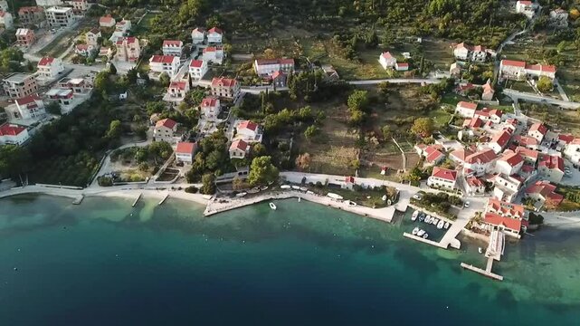 Houses on the northern shore of the Slano bay, drone shot, Croatia