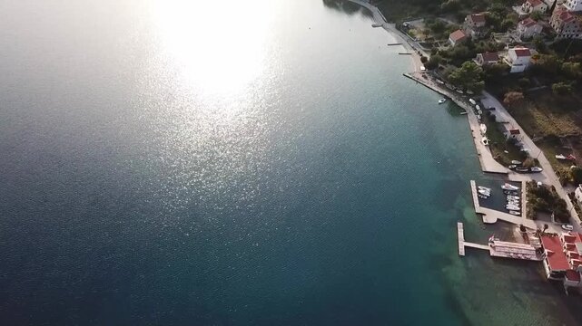 Turquoise clear water and the shore in the Slano bay, Croatia, drone shot