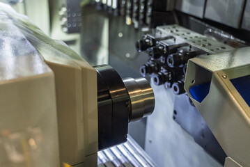 Cnc machine. The CNC lathe machine or Turning machine. Turning numerical control machine with tools and chuck. Inside view of a cnc machine. CNC lathe interior