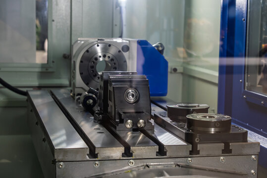 Milling machine with a rotary table. Multi axis CNC machine. Five-axis milling machining center. Interior of a CNC 5 axis milling machine