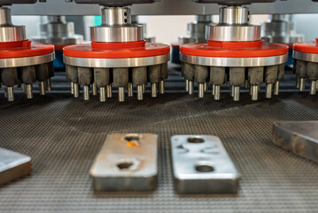 Grinding machine, Deburring Machines, view of the detail after deburring. An industrial machine for removing irregularities from parts in production