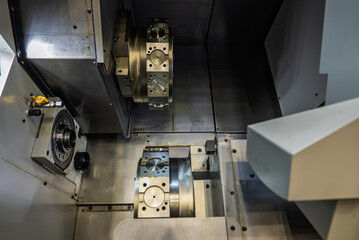 Cnc machine. The CNC lathe machine or Turning machine. Turning numerical control machine with tools and chuck. Inside view of a cnc machine. CNC lathe interior