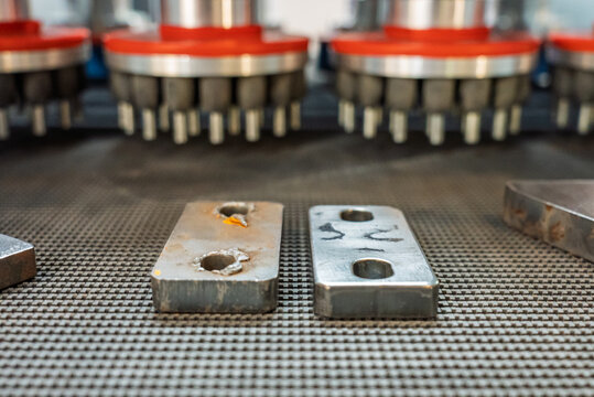 Grinding machine, Deburring Machines, view of the detail after deburring. An industrial machine for removing irregularities from parts in production