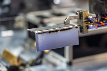 Robot welds steel. Welding head. Weld robot. CNC welding. Robotization and automation of the weld...