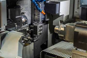 Cnc machine. The CNC lathe machine or Turning machine. Turning numerical control machine with tools and chuck. Inside view of a cnc machine. CNC lathe interior