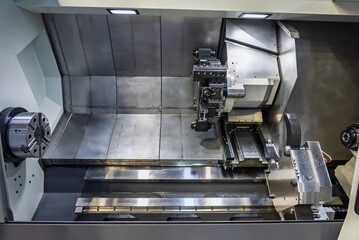 Cnc machine. The CNC lathe machine or Turning machine. Turning numerical control machine with tools and chuck. Inside view of a cnc machine. CNC lathe interior