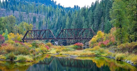  Panorama of vivid autumn colors by the river.