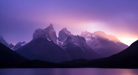 Stunning panoramic view of mountain peaks under a twilight sky, reflecting in calm lake