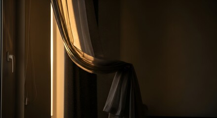 Golden sunlight streams through a sheer curtain near a window, illuminating the room