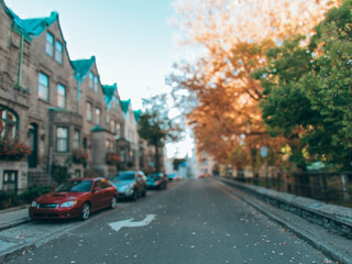 Charming blurred street in Quebec City during the fall season, with colorful autumn foliage and a cozy atmosphere