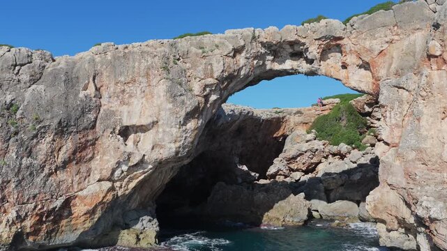 Aerial View: Cala Varques' Iconic Suspended Rock Arch Over the Mediterranean Sea, Mallorca