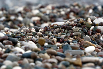 Colorful pebble stones on the beach, pebbles on the beach of Antalya, close-up, background