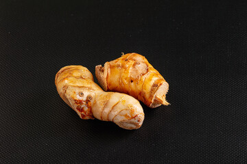 Raw galangal roots heap seasoning