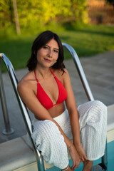 woman in red bikini at pool