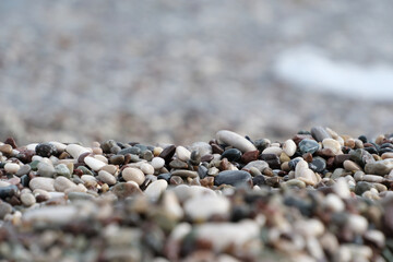 Colorful pebble stones on the beach, pebbles on the beach of Antalya, close-up, background