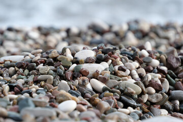 Colorful pebble stones on the beach, pebbles on the beach of Antalya, close-up, background