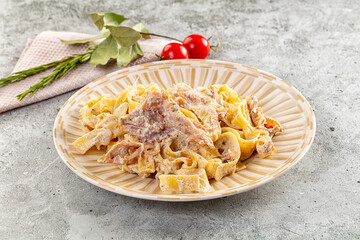 Italian pasta fettuccine with prosciutto