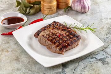 Grilled juicy beef steak with pepper