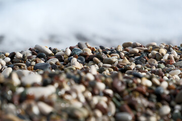 Colorful pebble stones on the beach, pebbles on the beach of Antalya, close-up, background