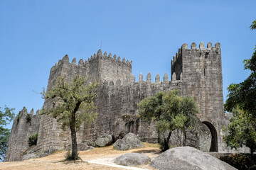 exterior of the 10th century castle in Old Town of Guimaraes city, Portugal