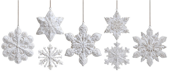 A collection of intricately designed white snowflake ornaments hanging in a row, showcasing detailed textures and patterns, perfect for winter holiday decorations