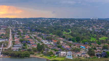 Fototapeta premium Aerial Drone View of Wentworth Point and Rhodes a suburb in western Sydney newly built residential high rise apartments area on Parramatta River Sydney NSW Australia
