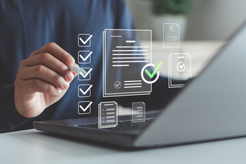 Businessman using a laptop with digital checklist and document approval icons, representing online task management, workflow automation and project completion in modern business operations.