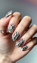 Beautiful woman's nails with zebra print