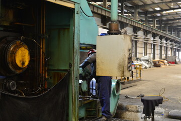 Workers on the production line of the strip steel coil factory are working