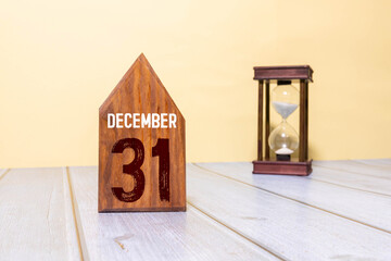 Monthly desk calendar for 31 December year on wooden