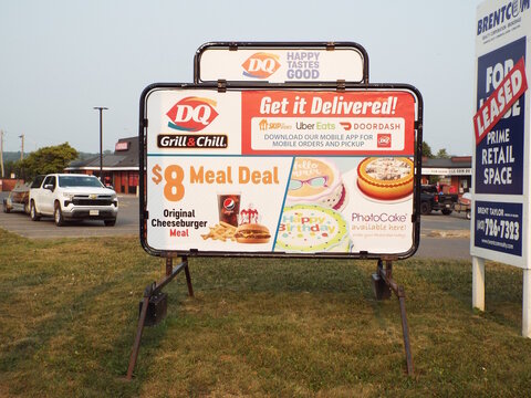  Gloucester, ON, Canada-May 23,2025:An outdoor recycling bin advertisement for real estate agent "Christiane Bauer", a Sales Representative with REMAX Hallmark Realty Group on Montr&eacute;al Rd.