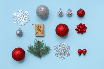 Beautiful composition with Christmas balls and decorative snowflake on blue background