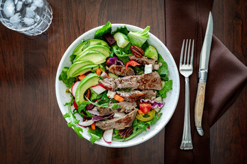 Above view of a fresh homemade steak salad, ready for eating.