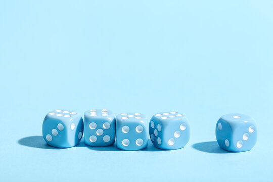 Game dices on blue background