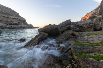 Samarra beach portugal rocks ocean waves long exposure sunset