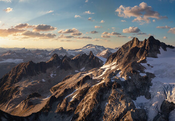 Mountain Landscape Peaks in BC, Canada. Dramatic Sunset Sky. Aerial Background