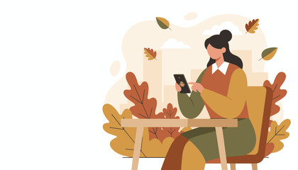 Woman using Android smartphone outdoors in a cozy autumn setting