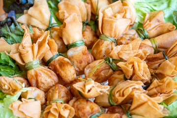 Thung thong is Thai fried bag dumplings made from pork and vegetables that are wrapped in dumplings and deep fried.
