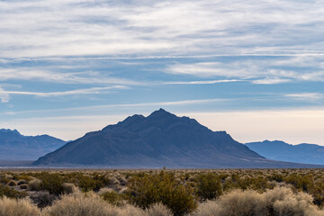 Eagle Mountain near Death Valley Junction, Inyo County.  Mojave Desert / Basin and Range Province. California State Route 127. In the distance is The Resting Spring Range. The Amargosa Valley
